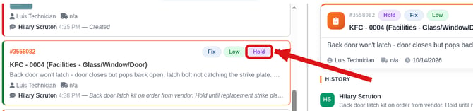 Tasks list showing a task with the Hold badge