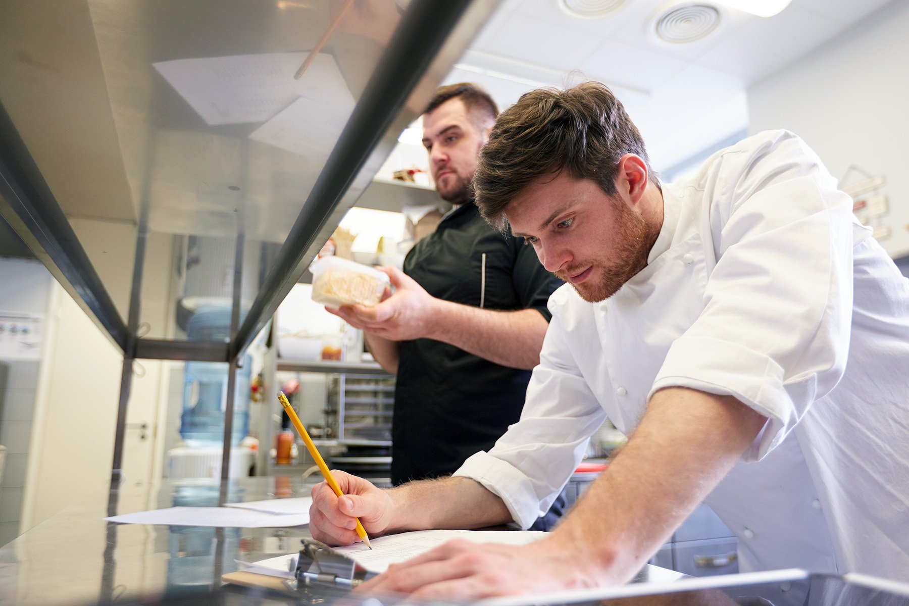 Kitchen staff working on their assigned tasks